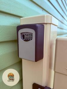 a soap dispenser on the side of a wall at Dune View Caravan in Ynys-lâs Station