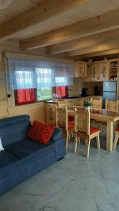 a living room with a couch and a table with chairs at Bachledowy Wierch 1 in Czerwienne +33 photos