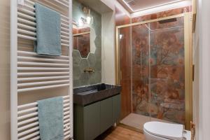 a bathroom with a sink and a shower at Claire de Lune in Asti +11 photos