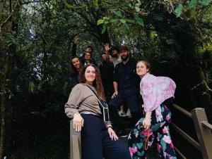 a group of people standing in the rainforest at A3A Oastel CoLiving - Children NO Allowed in Tanah Rata +40 photos
