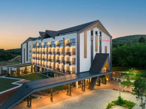 a rendering of a hotel with a large building at Movenpick Resort and Spa Fruske Terme in Vrdnik