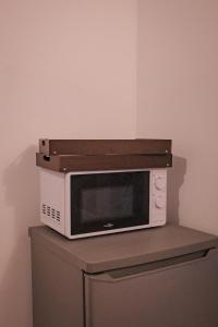 a microwave oven sitting on top of a table at CinémaRoom Béziers in Béziers