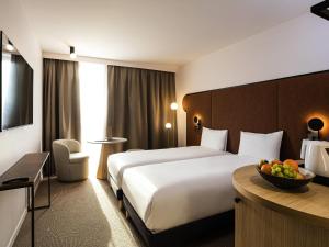 Ένα ή περισσότερα κρεβάτια σε δωμάτιο στο Mercure Dunkerque Centre Gare +112 φωτογραφίες