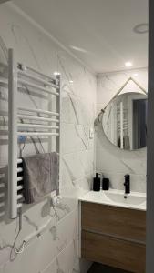a bathroom with a sink and a mirror at Lugar da Borralheira in Verdelhos +45 photos