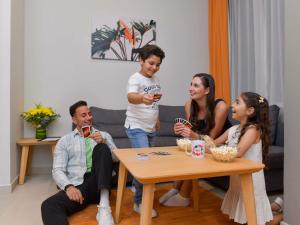 a group of people sitting around a table at Adagio Doha in Doha