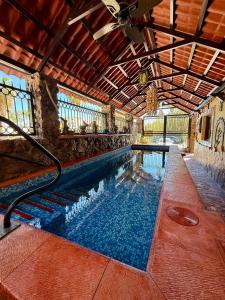 a swimming pool in a building with a swimming poolvisor at Marlin Suite - Walk to Beach & Town in Loreto