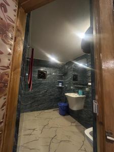 a bathroom with a tub and a sink at The Mool Farm and Living in Tangmarg