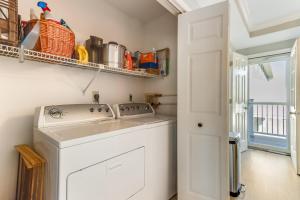a washer and dryer in a kitchen with a window at Seabreeze village 3 in Dewey Beach +28 photos