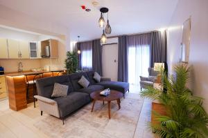 a living room with a couch and a table at Mabaat-White Pearl Compound 600 C Villa 24 in Jeddah