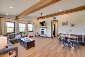 a living room with a couch and a table at Charming Lodi Retreat Walk to Local Wineries in Lodi