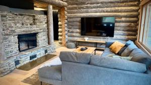 Posezení v ubytování Kelokurki - The Luxury Lodge Where Serenity Meets the Northern Lights