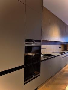Η κουζίνα ή μικρή κουζίνα στο Apartmán MONTARA +5 φωτογραφίες
