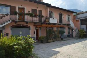 a building with flowers on the balconies of it at Appartamento Mara in Domodossola