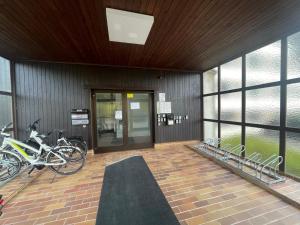 a building with bikes parked in front of a door at Ferienwohnung Naturblick in Bad Mitterndorf