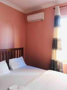 Ένα ή περισσότερα κρεβάτια σε δωμάτιο στο Vee Sweet Villa 2