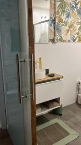 a bathroom with a sink and a mirror at Mirada Do Roxo in Oia +141 photos