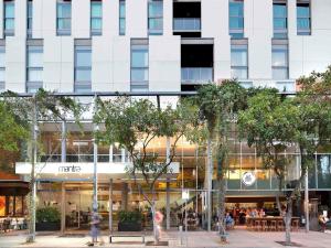 a rendering of a hotel with people walking in front of a building at Mantra South Bank Brisbane in Brisbane