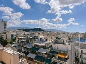 a view of a city with buildings at Loft 360' Acropolis in Mesochórion +10 photos