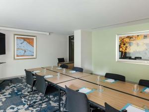 a meeting room with a long table and chairs at The Olsen Melbourne Art Series in Melbourne +109 photos