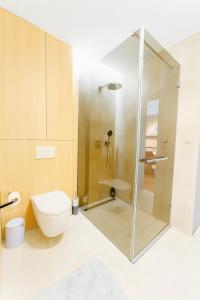 a bathroom with a shower and a toilet at Apartmán MONTARA in Donovaly +10 photos