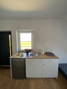 a kitchen with a sink and a counter top at Giby120C in Giby
