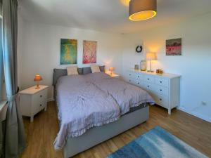 Postel nebo postele na pokoji v ubytování Ferienwohnung Feline + 2 fotografie