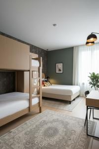 Ένα ή περισσότερα κρεβάτια σε δωμάτιο στο L21 Hotel Erfurt