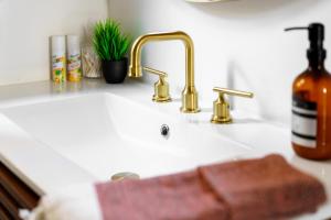 a kitchen sink with a faucet and a sink at Prime Location Top Rated Clean Parking Free! in Columbus