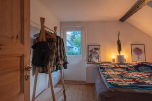 a bedroom with a bed and a window at Kåseberga Hideout in Kåseberga