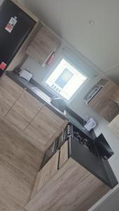 an overhead view of a kitchen with a window at A&l by the sea in Fleetwood
