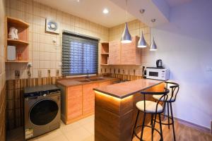 a kitchen with a sink and a dishwasher at Mabaat-White Pearl Compound 600 B Villa 16 in Jeddah