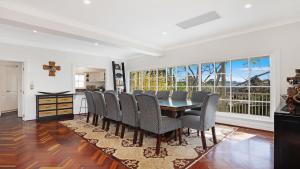 a dining room with a table and chairs at Southern Grace in Bowral