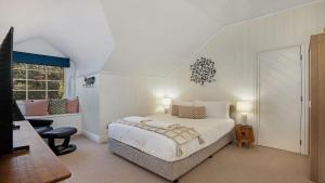 Ένα ή περισσότερα κρεβάτια σε δωμάτιο στο Southern Grace +31 φωτογραφίες