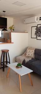 a living room with a couch and a table at El refugio in La Paloma