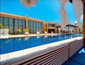 a large swimming pool in front of a building at Casa Milagres Morada do toque- By milagres hospitalidade in São Miguel dos Milagres +50 photos