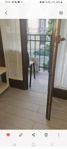 a room with a door open to a balcony at La dimora di Gabi in Venice