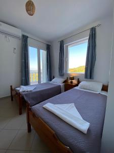 Ένα ή περισσότερα κρεβάτια σε δωμάτιο στο Villa Karras