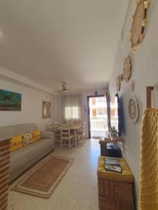 a living room with a couch and a table at Apartamento Rural Casa Mar in El Bosque