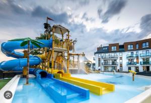 a water park with a water slide at Aquapark Bel Mare F429 in Międzyzdroje