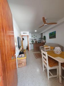 a living room with a table and a couch at Apartamento Rural Casa Mar in El Bosque