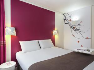 Ένα ή περισσότερα κρεβάτια σε δωμάτιο στο Mercure Le Mans Batignolles - Hotel & Spa