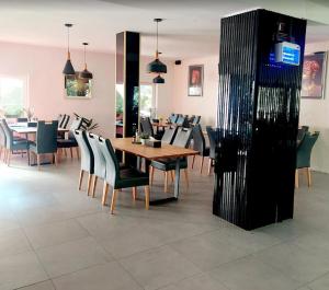 a dining room with a table and chairs at Cheile Braitei in Lupeni