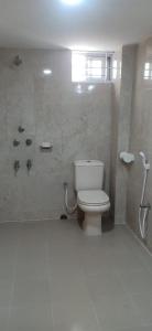 a bathroom with a toilet and a shower at 4 Bedroom Luxury House in Patantulla Sylhet in Sylhet