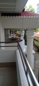 a balcony of a house with white columns at 4 Bedroom Luxury House in Patantulla Sylhet in Sylhet