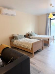 En eller flere senge i et værelse på Loft Riva, Smart TV, Klimanlage, Parkplatz fre, Minibar