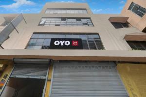 a building with an ovo sign on the side of it at Hotel O Paras in Āsansol