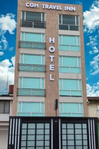 a building with a sign that reads cotin travel inn at Hotel CGH Travel INN Airport in Bogotá