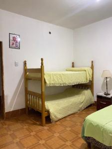 two bunk beds in a room with at Alojamiento Don Carmelo in Fiambala