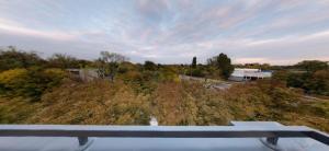a view from the roof of a house with trees at lux Apartman lazar in Pančevo