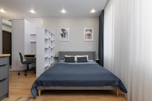 Ένα ή περισσότερα κρεβάτια σε δωμάτιο στο Jam Apartments Shevchenka